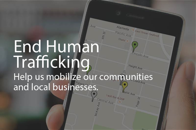 Photo of a cell phone, with an app open to a map with locations pinged. Caption: End Human Trafficking. Help us mobilize our communities and local businesses.